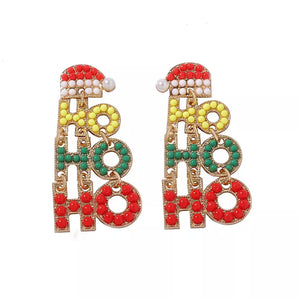 Festive holiday earrings with HO HO HO text, Santa hats, and colorful beads.