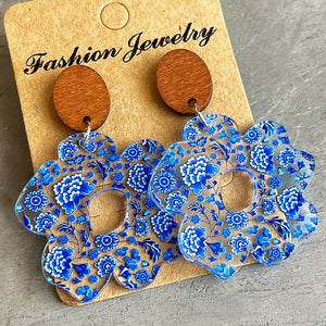 Floral acrylic drop earrings with blue chinoiserie pattern and wooden tops.
