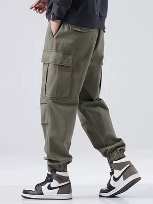 Army green relaxed fit cargo sweatpants with multiple pockets and elastic cuffs.