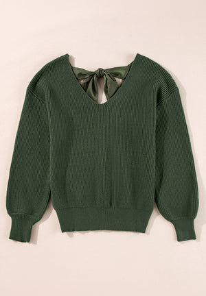 Dark green ribbed knit sweater with a V-neck and satin bow detail at the back.