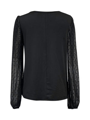 Black blouse with sheer dot long sleeves and V-neck.