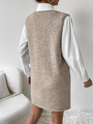 Sleeveless knit mini dress in mocha with pocket detail, styled over a white shirt.