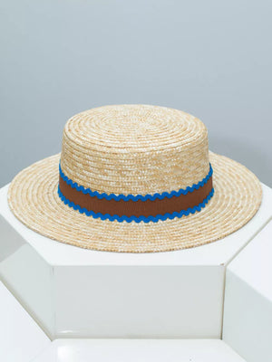 Straw boater hat with brown band and blue scalloped trim
