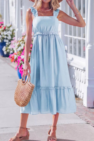 Light blue ruffle-trimmed maternity dress with square neckline and tiered skirt.