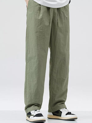 Relaxed fit wide-leg sweatpants in sage green with a crinkled texture.