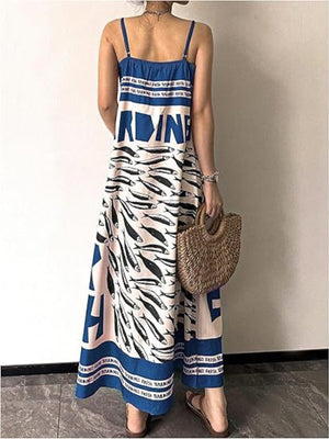 Blue spaghetti strap maxi dress with sardine print and text detail.