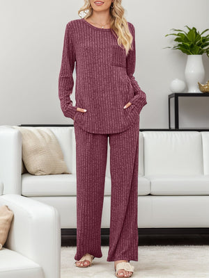 Ribbed knit lounge set in deep purple with long sleeves, crew neck, chest pocket, and wide-leg pants.