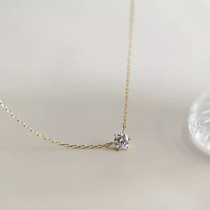 Delicate sterling silver necklace with a clear zircon pendant.