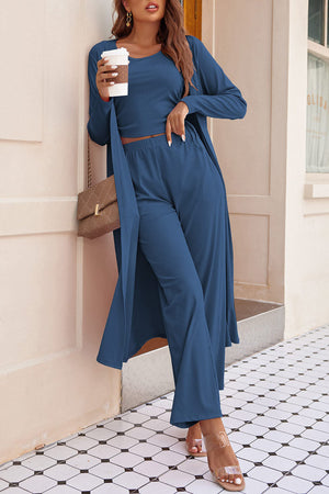 Ribbed knit duster and lounge set in navy blue, featuring a cropped top and wide-leg pants.