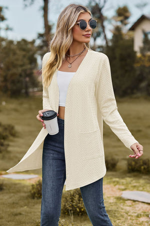 Cream textured open-front cardigan with pockets and long sleeves.