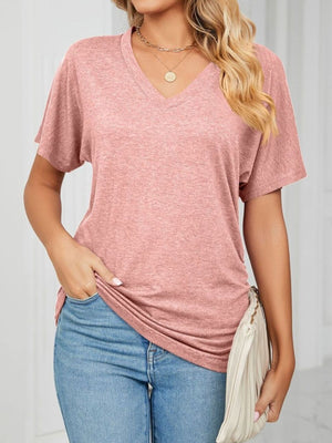 Relaxed pink V-neck short sleeve t-shirt with draping and a soft texture.