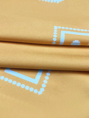 Geometric print midi dress in mustard yellow with light blue pattern detail.