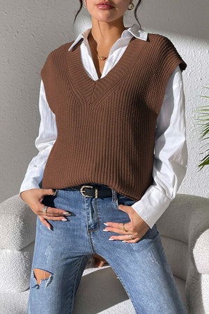 Textured knit V-neck sleeveless top in chocolate acrylic, styled with a white shirt and jeans.