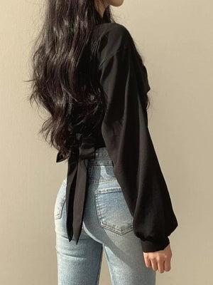 Black long sleeve maternity shirt with knot detail and balloon sleeves