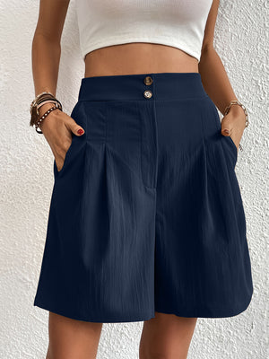 Dark Blue pleated front bermuda shorts with button detail and pockets.