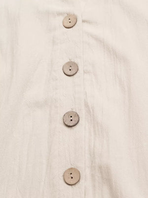 Apricot cotton mini dress with V-neck and wooden button detail