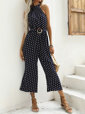 Navy polka dot wide-leg romper with halter neck and belted waist