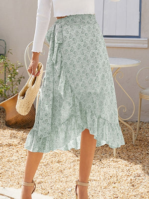 Asymmetric wrap skirt in Gum Leaf with a leaf print and ruffled hem.