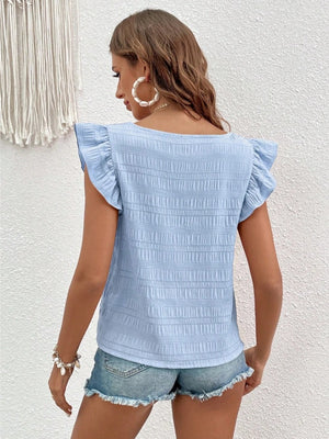 Light blue textured square neck blouse with ruffle sleeves.