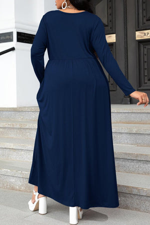 Navy long sleeve maxi dress with gathered waist and pockets.