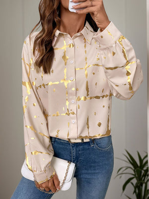 Tan blouse with gold brushstroke pattern and gathered sleeves.