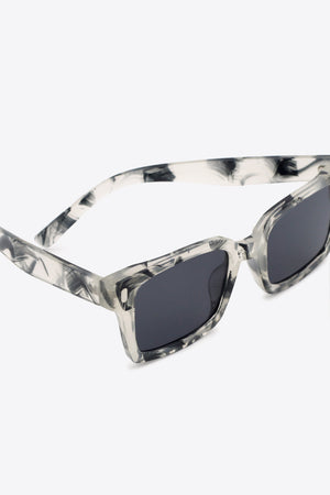 Marble effect rectangular sunglasses with dark lenses and grey marble pattern frames.