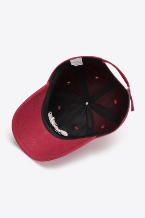 Deep Red baseball cap with embroidered detail and adjustable strap.