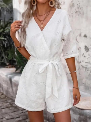 White eyelet wrap romper with tie waist and short sleeves