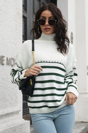 Turtleneck knit sweater with green and white Breton stripes and a textured yoke.