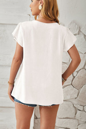 White textured V-neck blouse with pleated cap sleeves