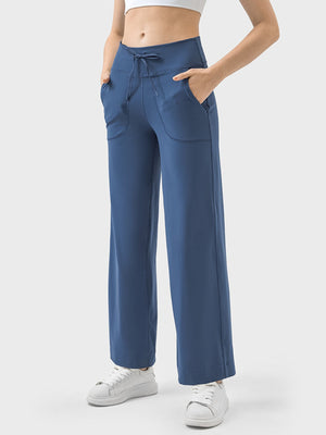 Dusty blue wide-leg drawstring active trousers with pockets and a relaxed fit.