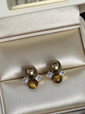 Spherical tiger eye stone stud earrings with clear accents and gold pearls