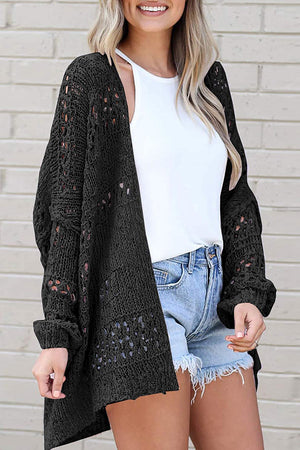 Black open-knit slouchy cardigan with crochet details and long sleeves.