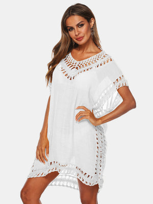 White kaftan cover-up with crochet trim neckline, sleeves, and hem.
