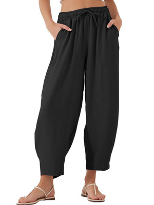 Black balloon trousers with drawstring waist and sculpted seam detail