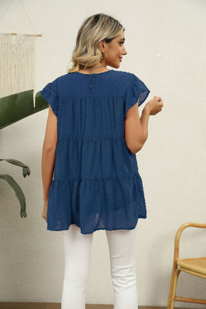 Peacock Blue Swiss dot tiered blouse with flutter sleeves and round neckline.