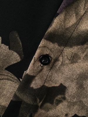 Men's oversized floral print shirt in tan and black cotton, showing button detail.