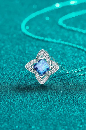 Sky blue moissanite and diamond pendant necklace with floral design