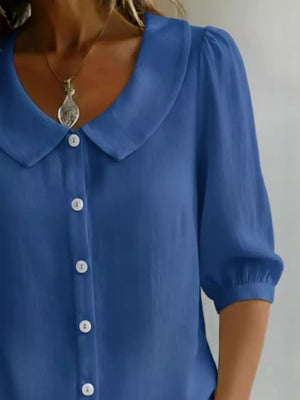 Royal blue button-down shirt with Peter Pan collar and puff sleeves.
