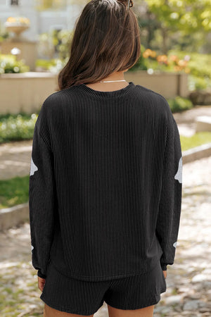 Black glitter ghost loungewear set with ribbed texture and shorts.