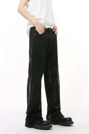 Faded flare denim jeans in dark wash with a relaxed fit and subtle distressed details.