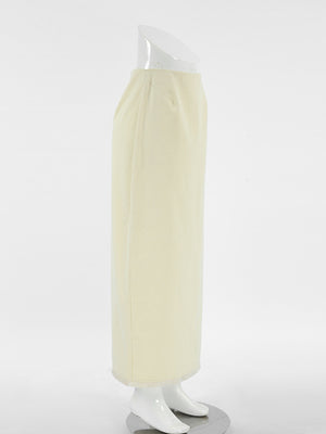 Chic cotton midi skirt in beige with a side slit and frayed hem.