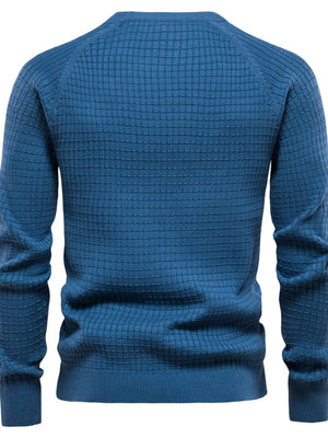 Textured grid crewneck sweater in peacock blue with raglan sleeves.