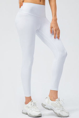 White high-rise performance leggings with sculpted seams and a breathable fit.