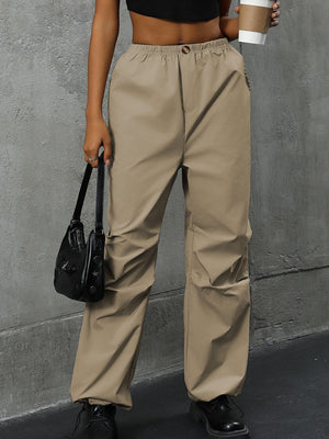 Khaki gathered-leg utility trousers with elasticated cuffs and a relaxed fit.