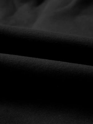 Black cotton joggers with a textured knit detail.