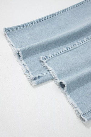 Light wash denim jeans with raw hem detail
