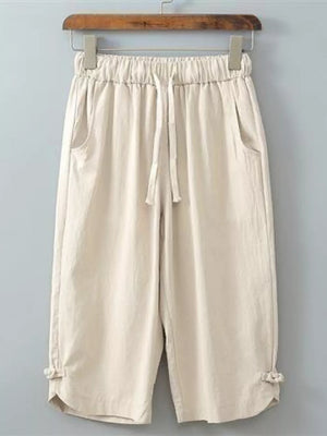 Khaki drawstring cropped sweatpants with tie details at the hem.