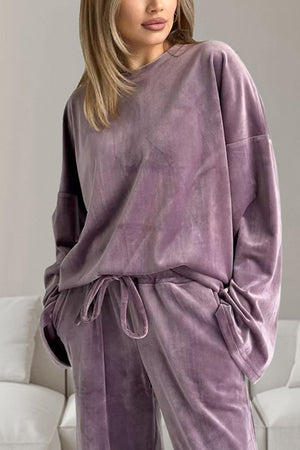 Mauve velvet loungewear set with wide sleeves and drawstring pants.