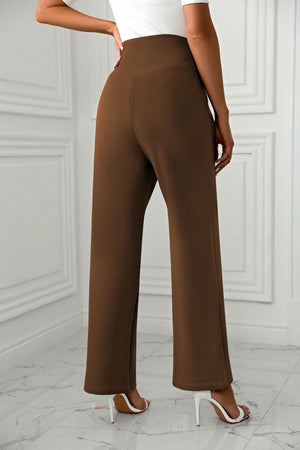 Brown wide-leg trousers with a sculpted waist, shown from the back.